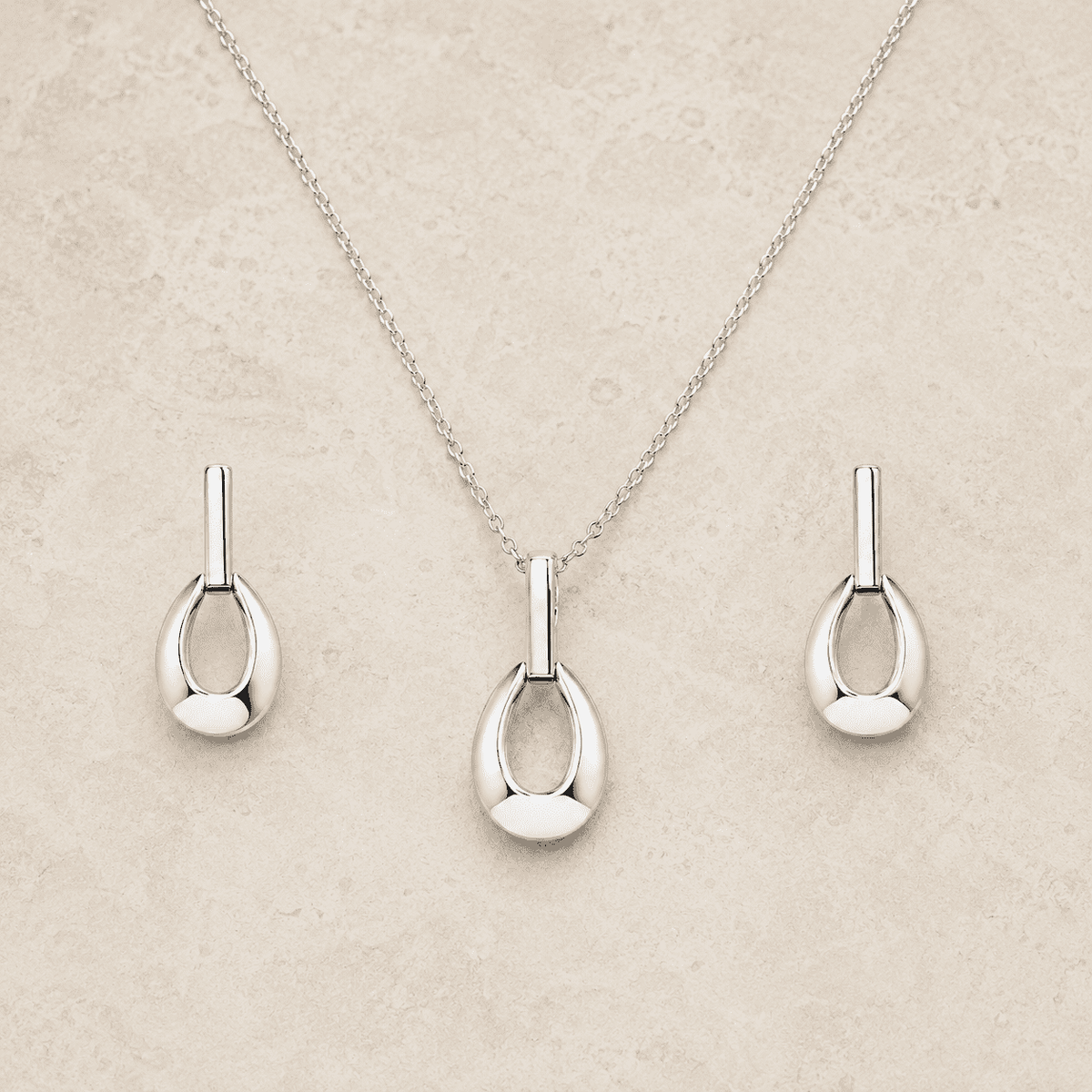 The Happy Tears Solitaire Set — Gold Plated Évara Drop Pendant Set by House of Zena, worn on model