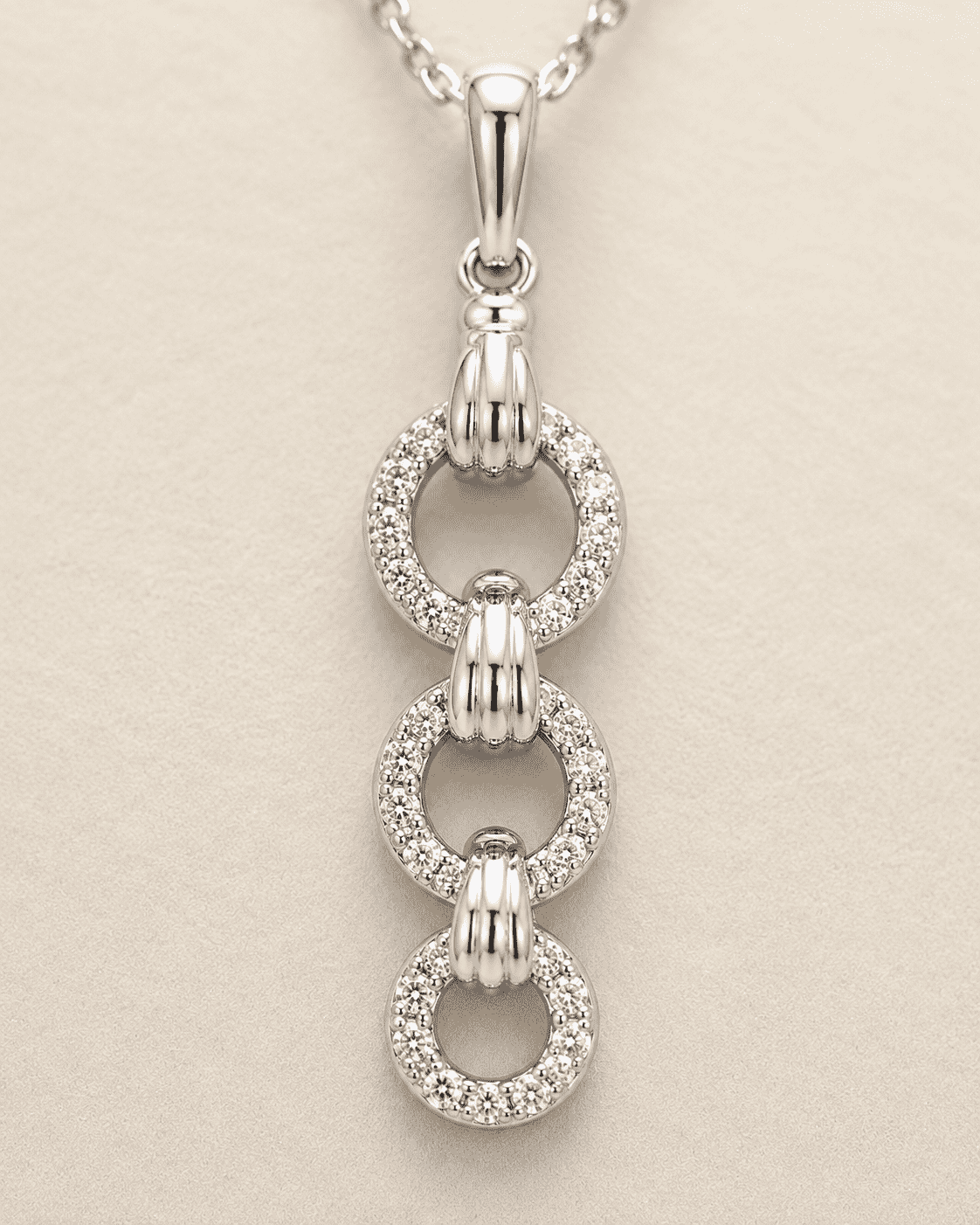 The "You & Me" Interlock Set — Silver-Tone Link Pendant Set by House of Zena, close-up detail