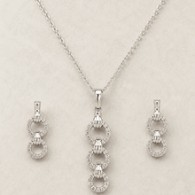 The "You & Me" Interlock Set — Silver-Tone Link Pendant Set by House of Zena, side angle