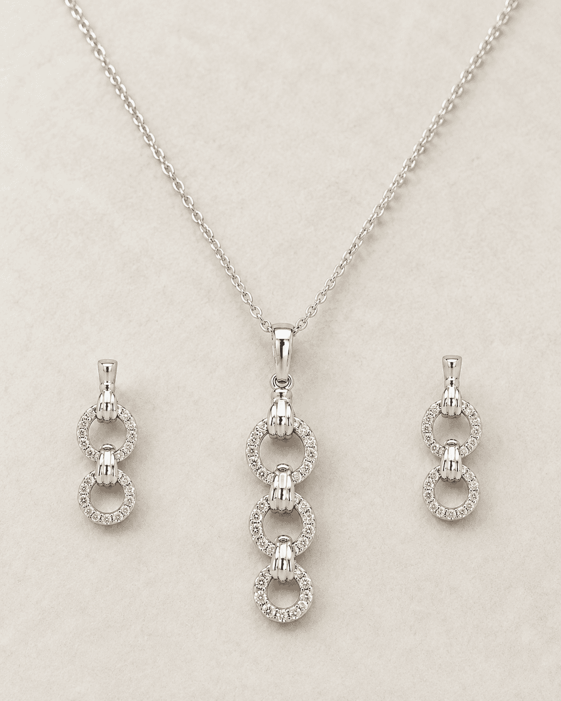 The "You & Me" Interlock Set — Silver-Tone Link Pendant Set by House of Zena, side angle
