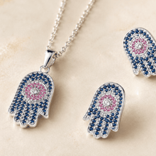 The "Good Karma Only" Hamsa Set — Silver-Tone Hamsa Pendant Set by House of Zena, styled on model