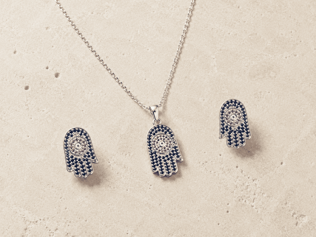 The "Good Karma Only" Hamsa Set — Silver-Tone Hamsa Pendant Set by House of Zena, worn on model