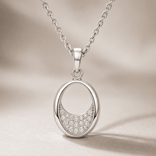 The Almond Truffle Solitaire Set — Silver-Tone Oval Pendant Set by House of Zena, styled on model