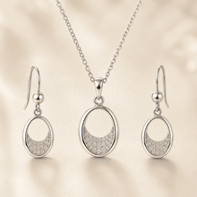 The Almond Truffle Solitaire Set — Silver-Tone Oval Pendant Set by House of Zena, worn on model