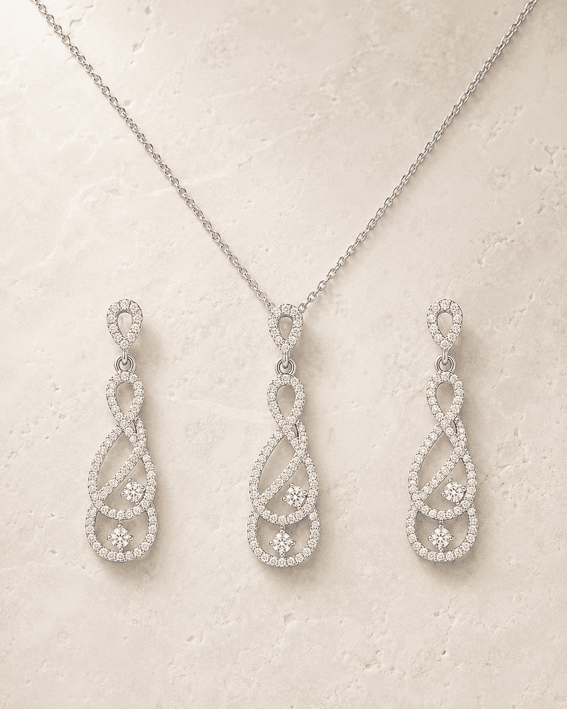 The "Pinky Promise" Infinity Set — Silver-Tone Infinity Grace Pendant Set by House of Zena, worn on model