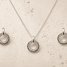 The Black Truffle Midnight Set — Silver-Tone Halo Pendant Set by House of Zena, worn on model