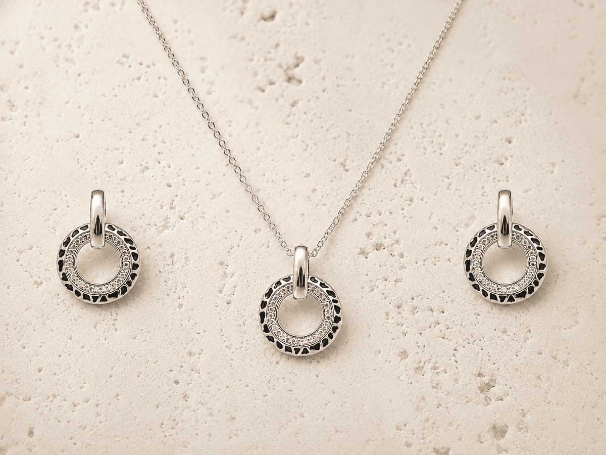 The Black Truffle Midnight Set — Silver-Tone Halo Pendant Set by House of Zena, worn on model