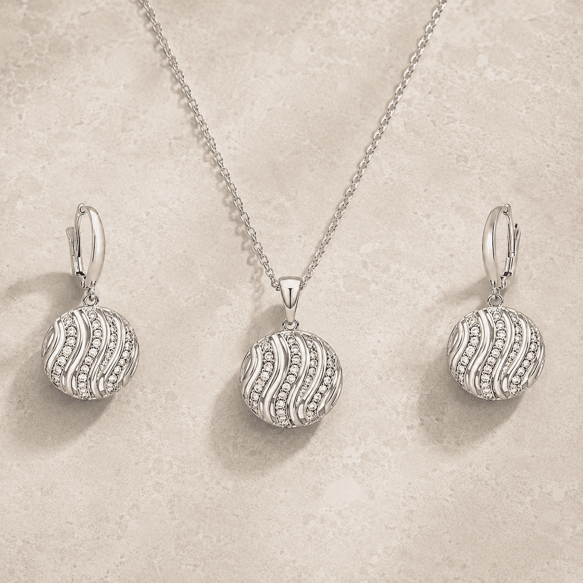 The Golden Hour Ripple Set — Silver-Tone Wave Pendant Set by House of Zena, worn on model