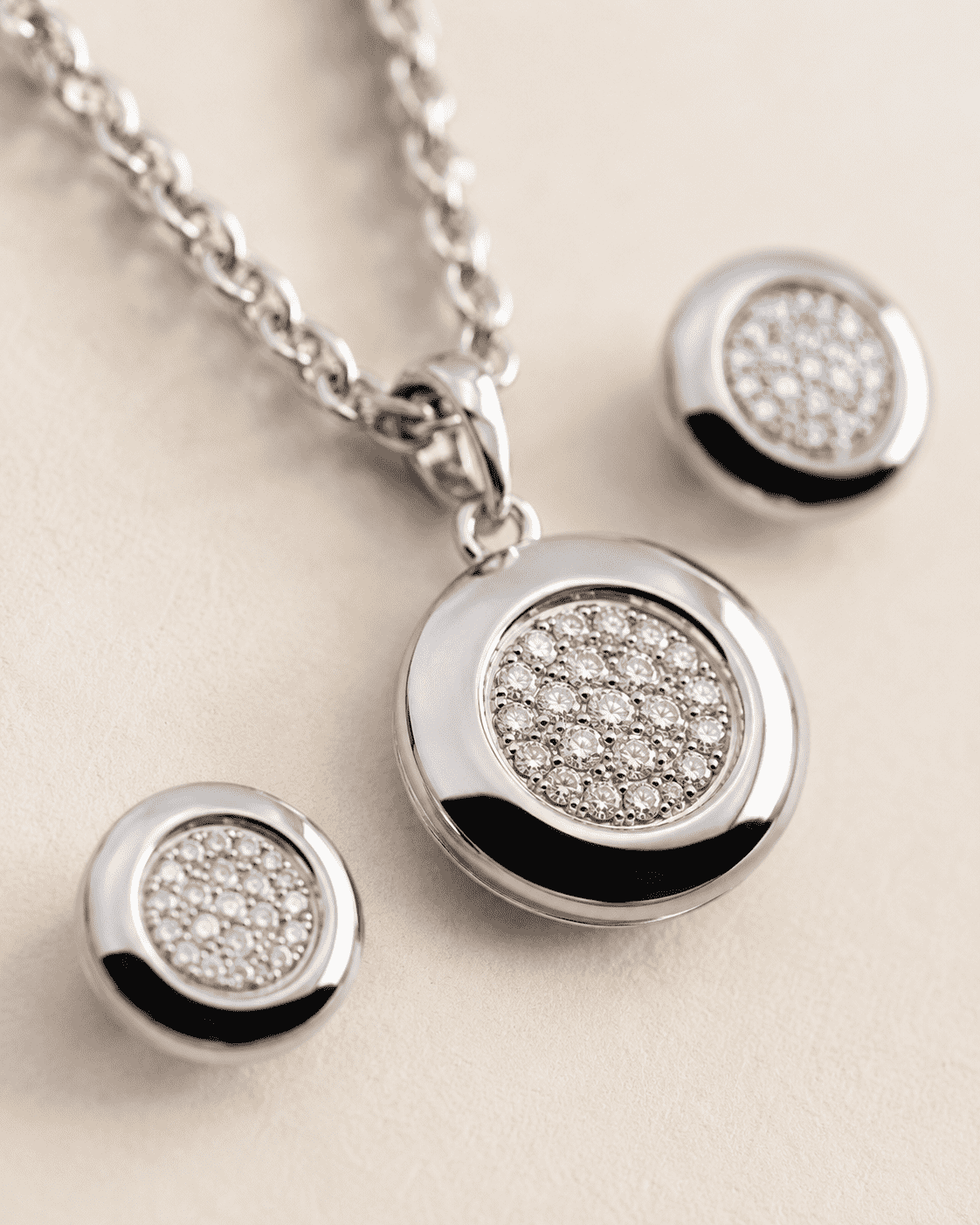 The Mooncake Pearl Glow Set — Silver-Tone Glow Pendant Set by House of Zena, styled on model