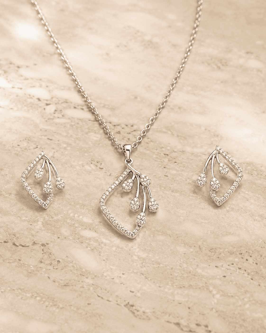 The Morning Dewdrop Set — Silver-Tone Dewdrop Elegance Pendant Set by House of Zena, worn on model