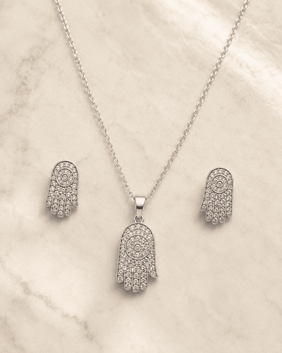 The "Holy Grail" Protection Set — Gold Plated Hamsa Pendant Set by House of Zena, close-up detail
