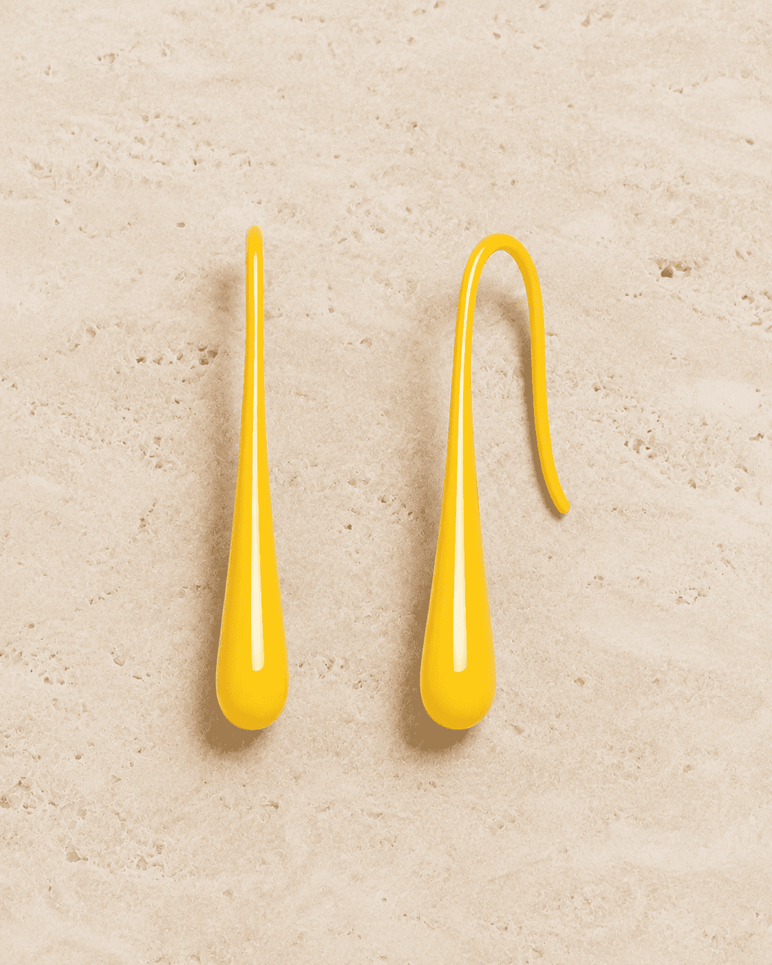 The Sunny Lemon Mini Huggies — Gold Plated Sunbeam Drop Huggie Earrings by House of Zena, styled on model