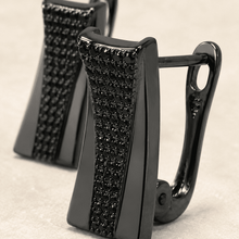 The Total Eclipse Studs — Gold Plated Eclipse Stud Earrings by House of Zena, worn on model