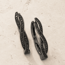 The Licorice Twist Hoops — Gold Plated Twist Hoop Earrings by House of Zena, styled on model