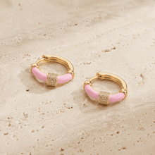 The Strawberry Milk Huggies — Gold Plated Blush Halo Huggie Earrings by House of Zena, worn on model