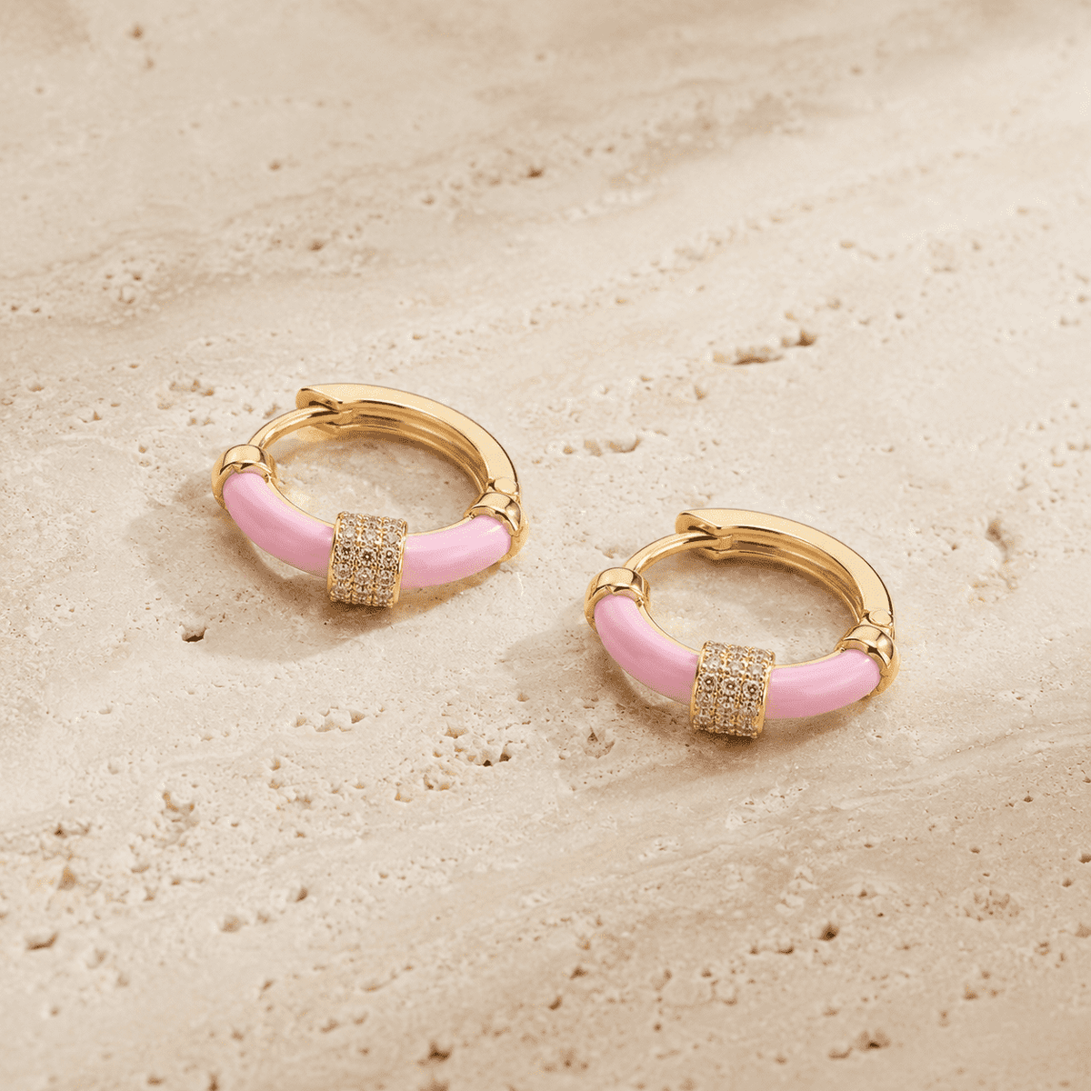 The Strawberry Milk Huggies — Gold Plated Blush Halo Huggie Earrings by House of Zena, worn on model