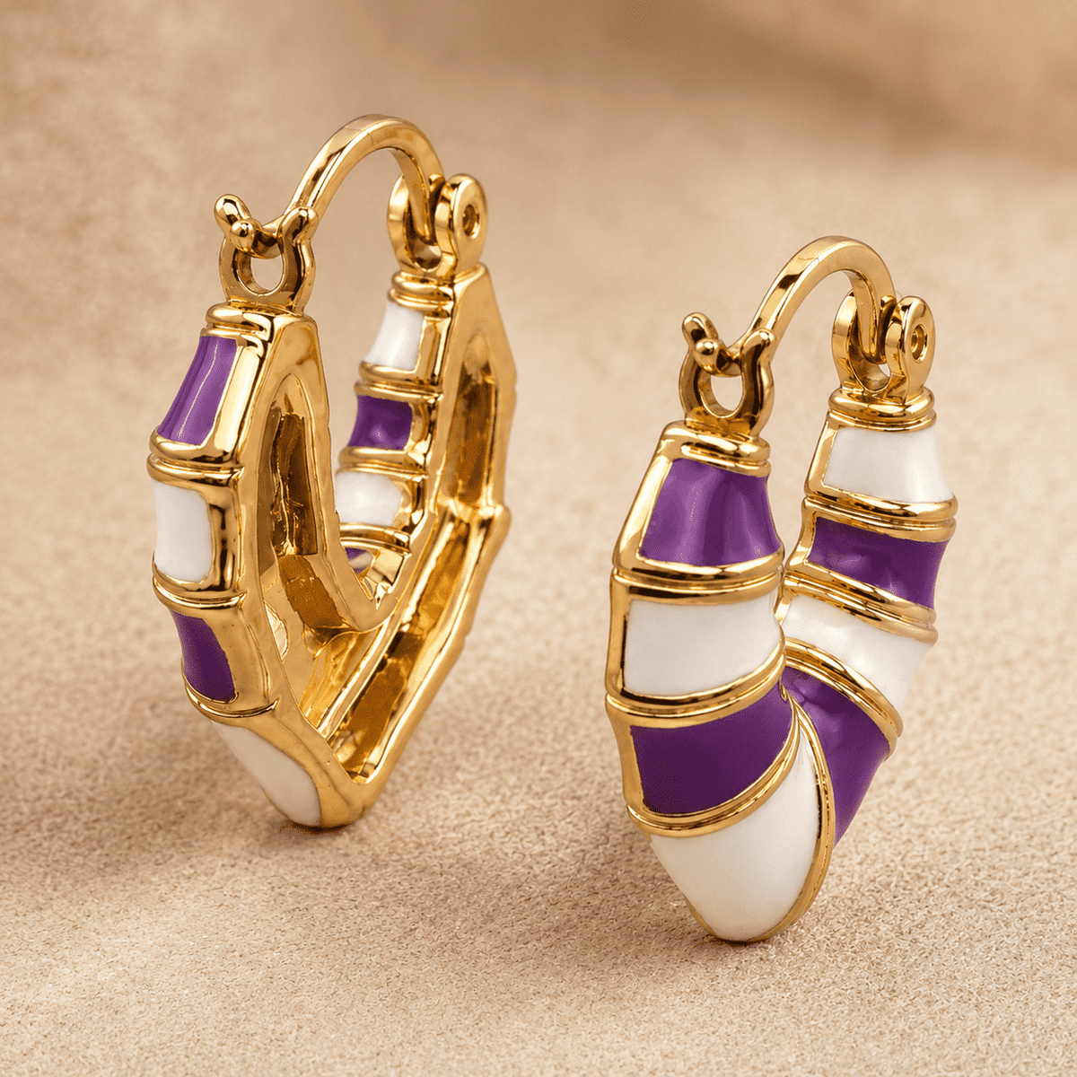 The Lavender Swirl Huggies — Gold Plated Amethyst Swirl Huggie Earrings by House of Zena, flat lay