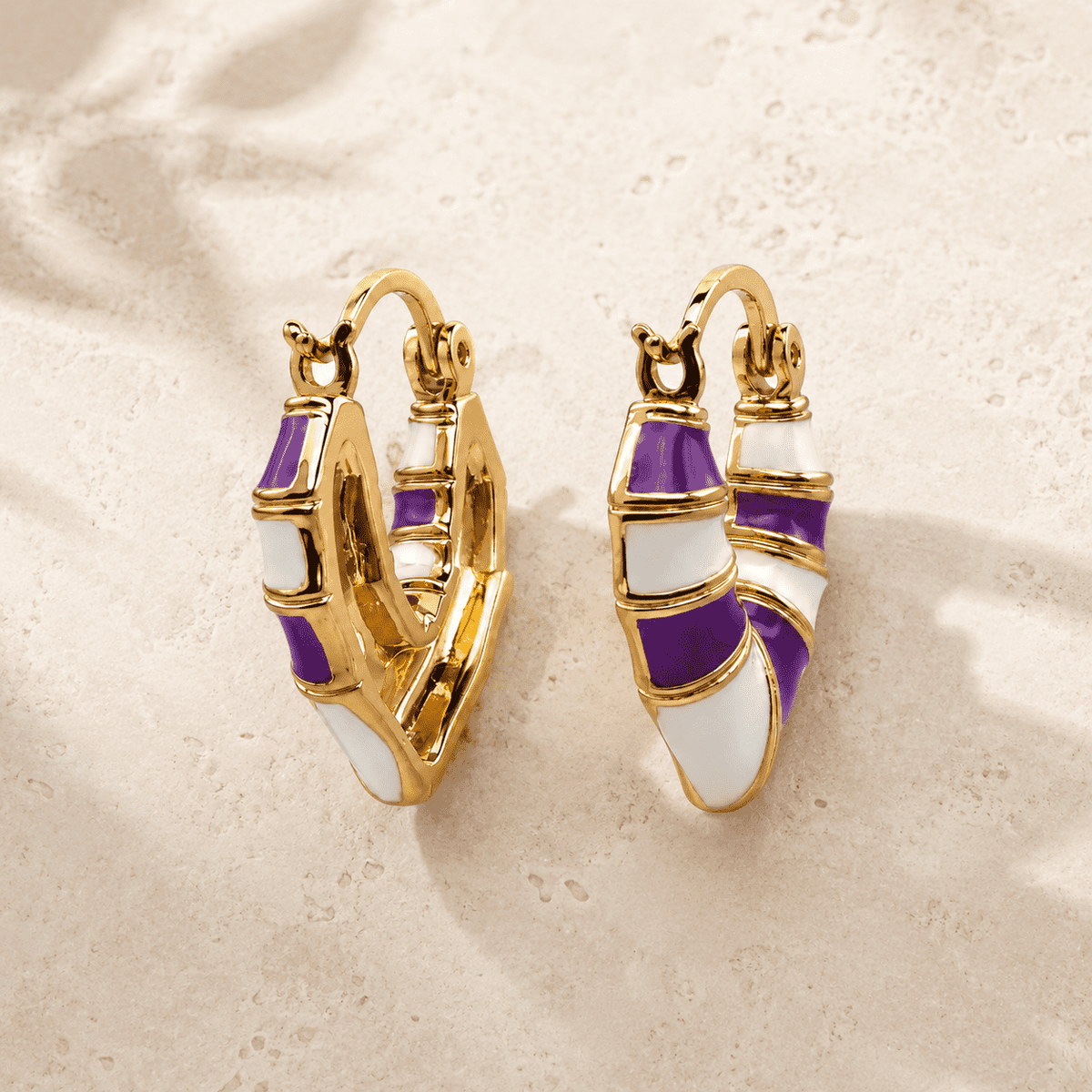 The Lavender Swirl Huggies — Gold Plated Amethyst Swirl Huggie Earrings by House of Zena, worn on model