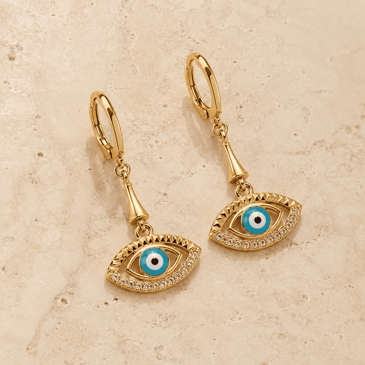 The Side-Eye Charm Drops — Gold Plated Evil Eye Drop Earrings by House of Zena, side angle