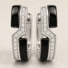 The Black Sesame Crescent Hoops — Silver-Tone Curve Hoop Earrings by House of Zena, worn on model