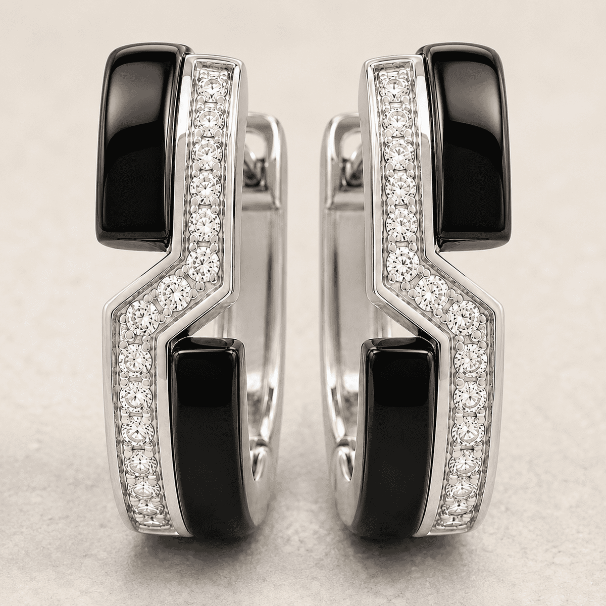 The Black Sesame Crescent Hoops — Silver-Tone Curve Hoop Earrings by House of Zena, worn on model