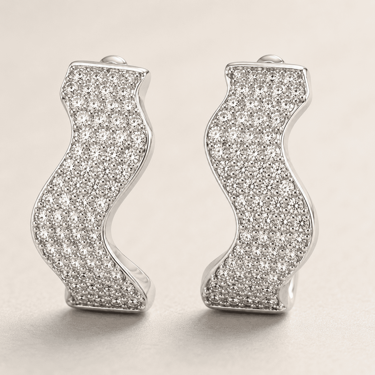 The Ocean Ripple Huggies — Silver-Tone Wave Huggie Earrings by House of Zena, side angle
