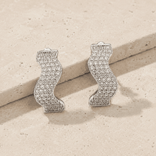 The Ocean Ripple Huggies — Silver-Tone Wave Huggie Earrings by House of Zena, close-up detail