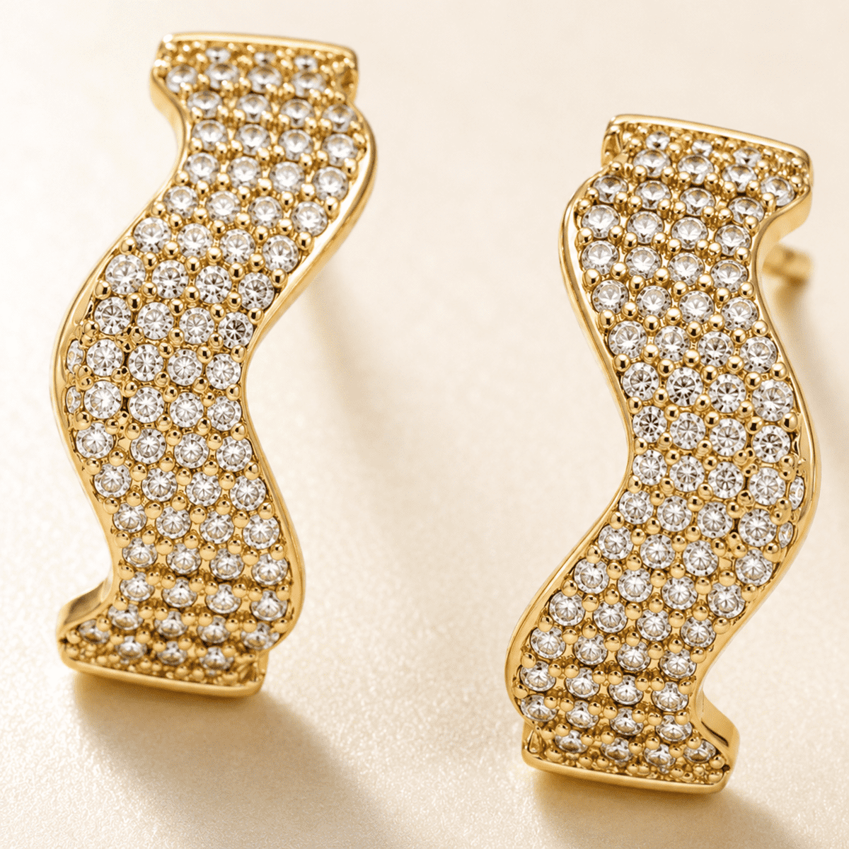 The Golden Nugget Huggies — Gold Plated Wave Crystal Huggie Earrings by House of Zena, close-up detail