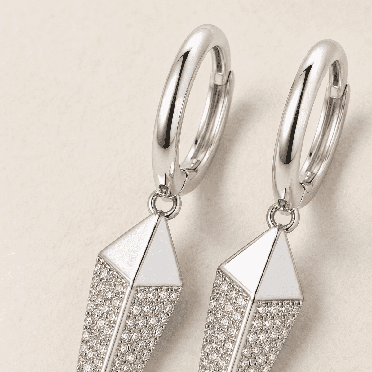The Diamond Dust Prism Drops — Silver-Tone Silver Prism Luxe Drop Earrings by House of Zena, worn on model