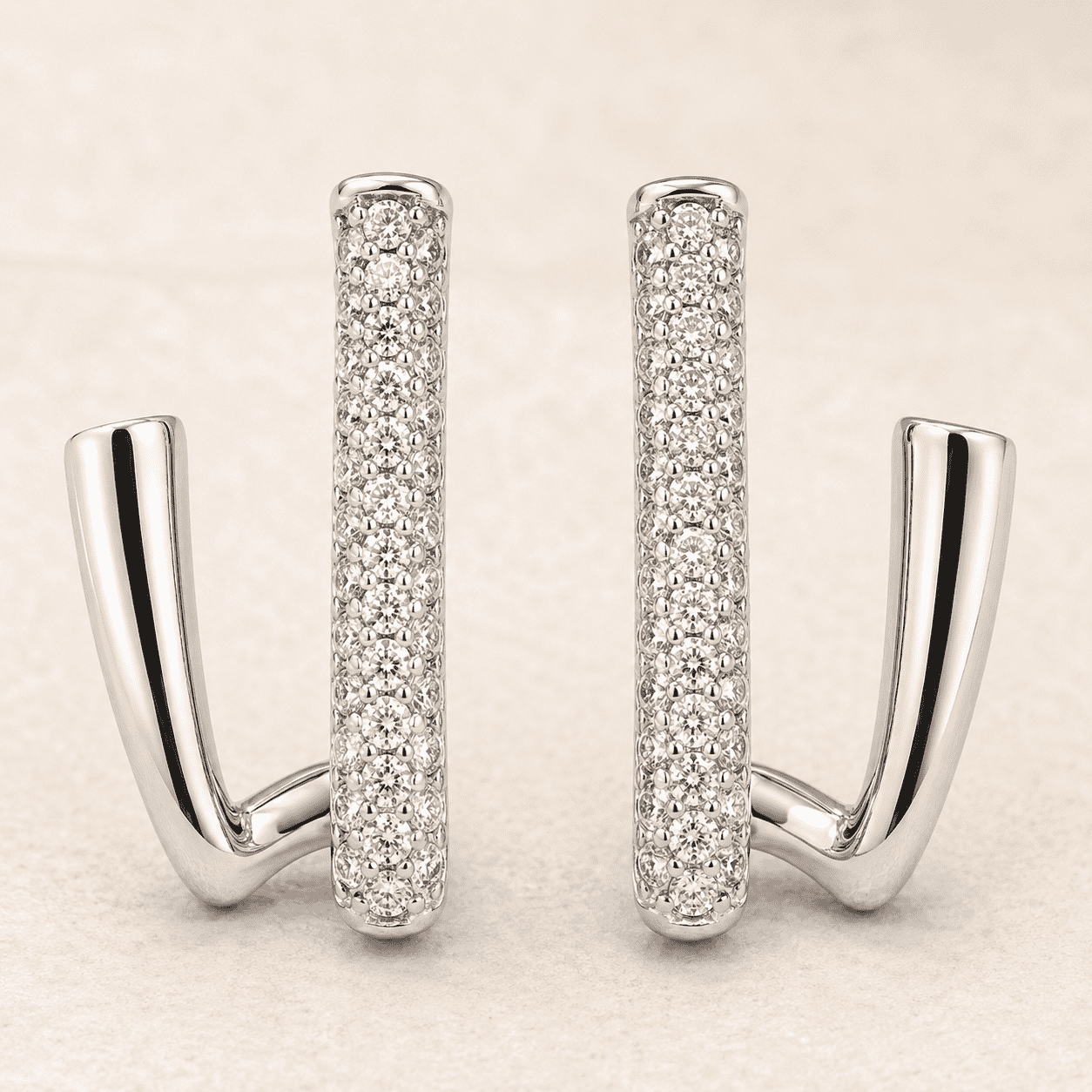 The Crisscross Pavé Illusion Hoops — Silver-Tone Dual Curve Pavé Hoop Earrings by House of Zena, styled on model — Anti-Tarnish Waterproof Jewellery | House of Zena