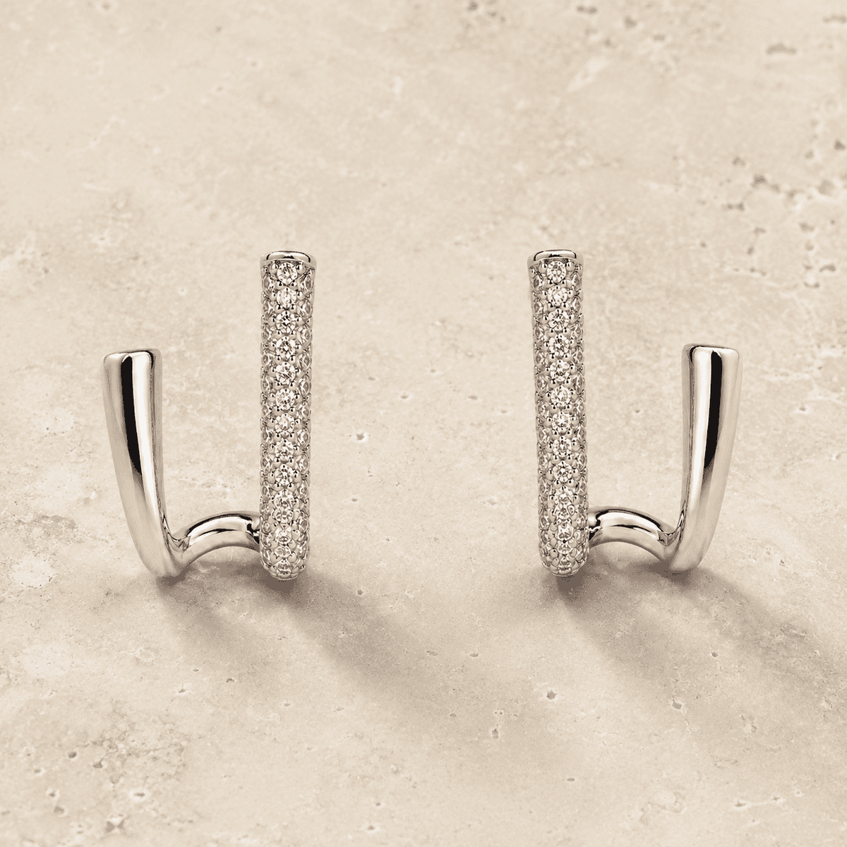The Crisscross Pavé Illusion Hoops — Silver-Tone Dual Curve Pavé Hoop Earrings by House of Zena, side angle