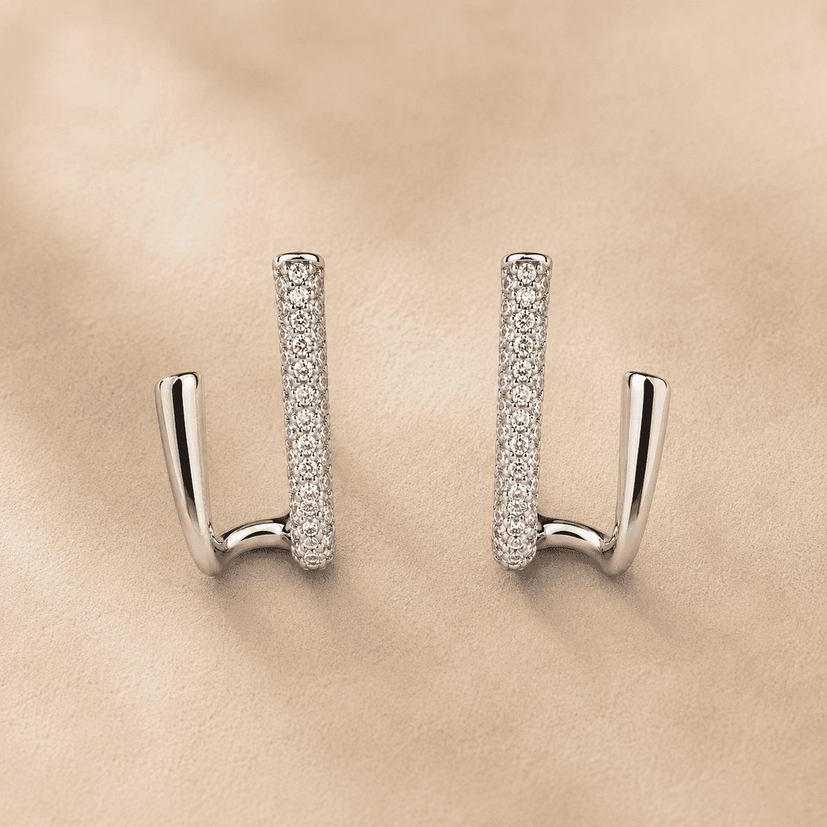 The Crisscross Pavé Illusion Hoops — Silver-Tone Dual Curve Pavé Hoop Earrings by House of Zena, close-up detail