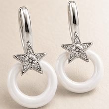 The Happy Tears Solitaire Drops — Silver-Tone Halo Drop Earrings by House of Zena, styled on model