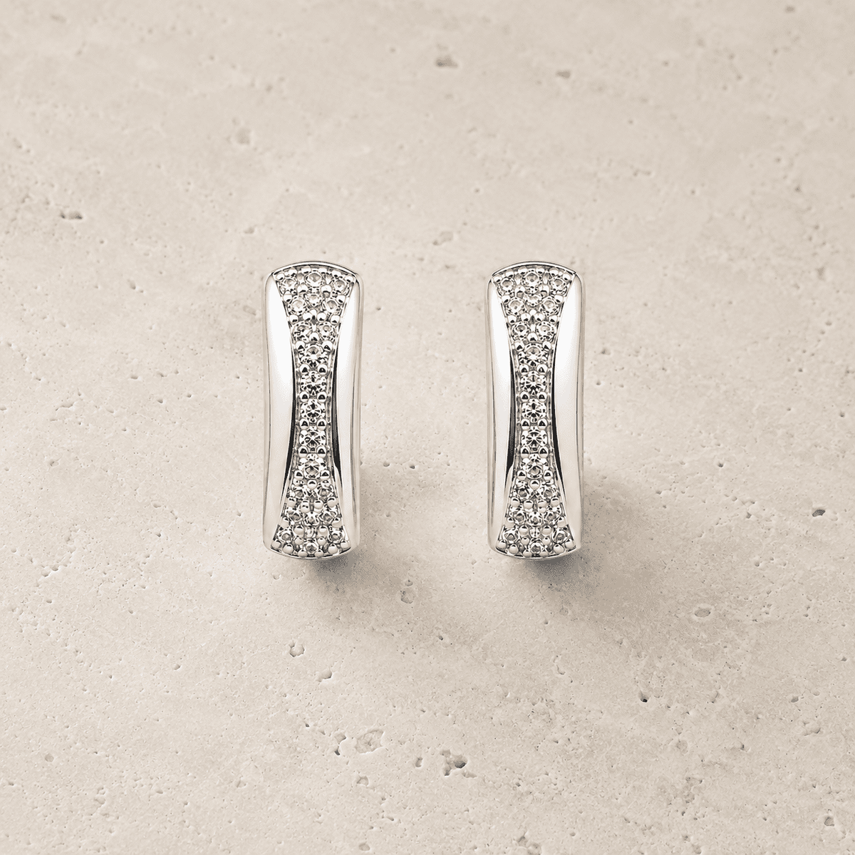 The Fortune Cookie Studs — Silver-Tone Curve Stud Earrings by House of Zena, worn on model