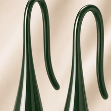 The Green Apple Mini Huggies — Gold Plated Emerald Drop Huggie Earrings by House of Zena, styled on model