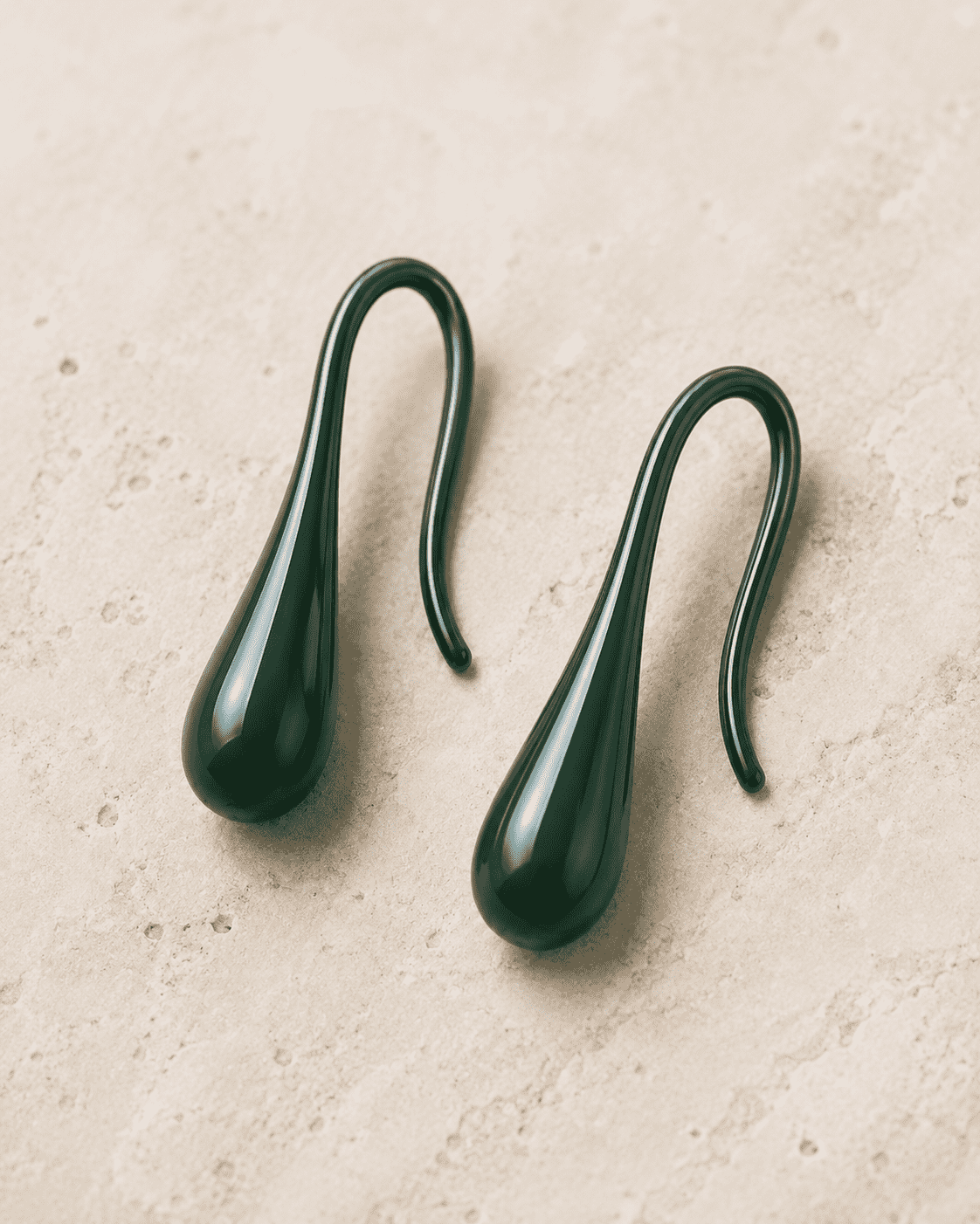The Green Apple Mini Huggies — Gold Plated Emerald Drop Huggie Earrings by House of Zena, worn on model