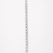 The St. Tropez Chevron Tennis — Silver-Tone Chevron Bracelet by House of Zena, worn on model