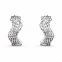 The Ocean Ripple Huggies — Silver-Tone Wave Huggie Earrings by House of Zena, flat lay