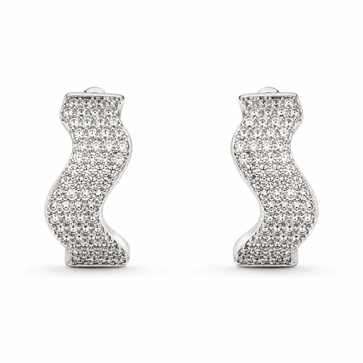 The Ocean Ripple Huggies — Silver-Tone Wave Huggie Earrings by House of Zena, flat lay