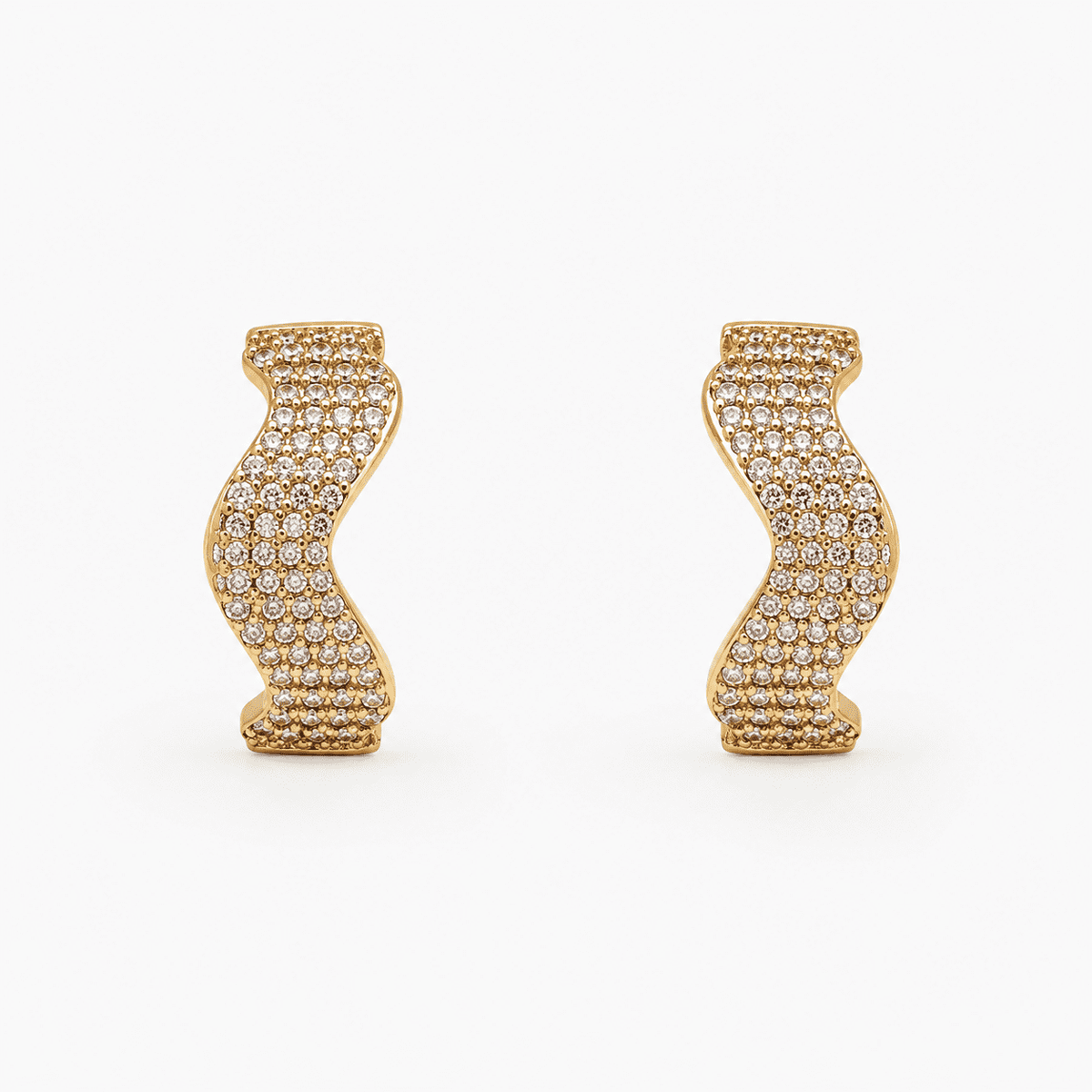 The Golden Nugget Huggies — Gold Plated Wave Crystal Huggie Earrings by House of Zena, flat lay