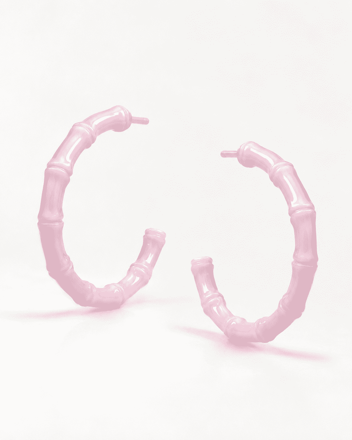 The Rose Quartz Bamboo Hoops — Gold Plated Blush Bamboo Hoop Earrings by House of Zena, worn on model