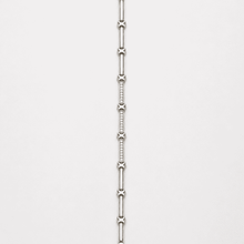The Café Au Lait Puff Link — Silver-Tone Link Bracelet by House of Zena, worn on model
