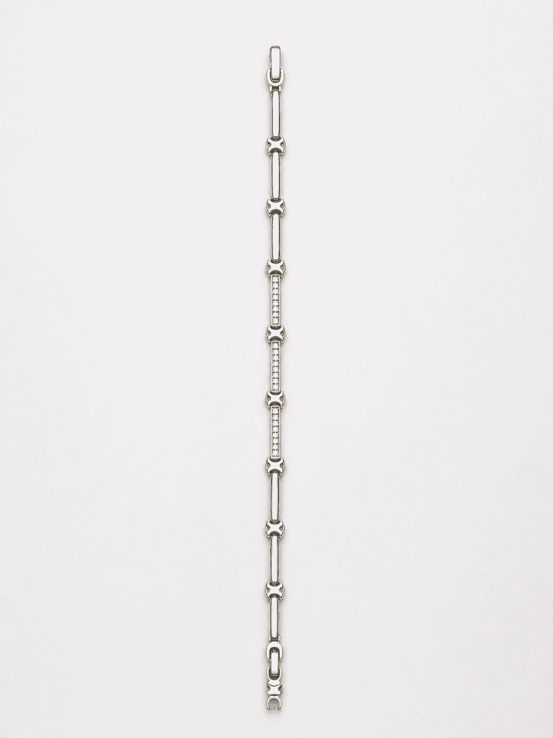 The Café Au Lait Puff Link — Silver-Tone Link Bracelet by House of Zena, worn on model