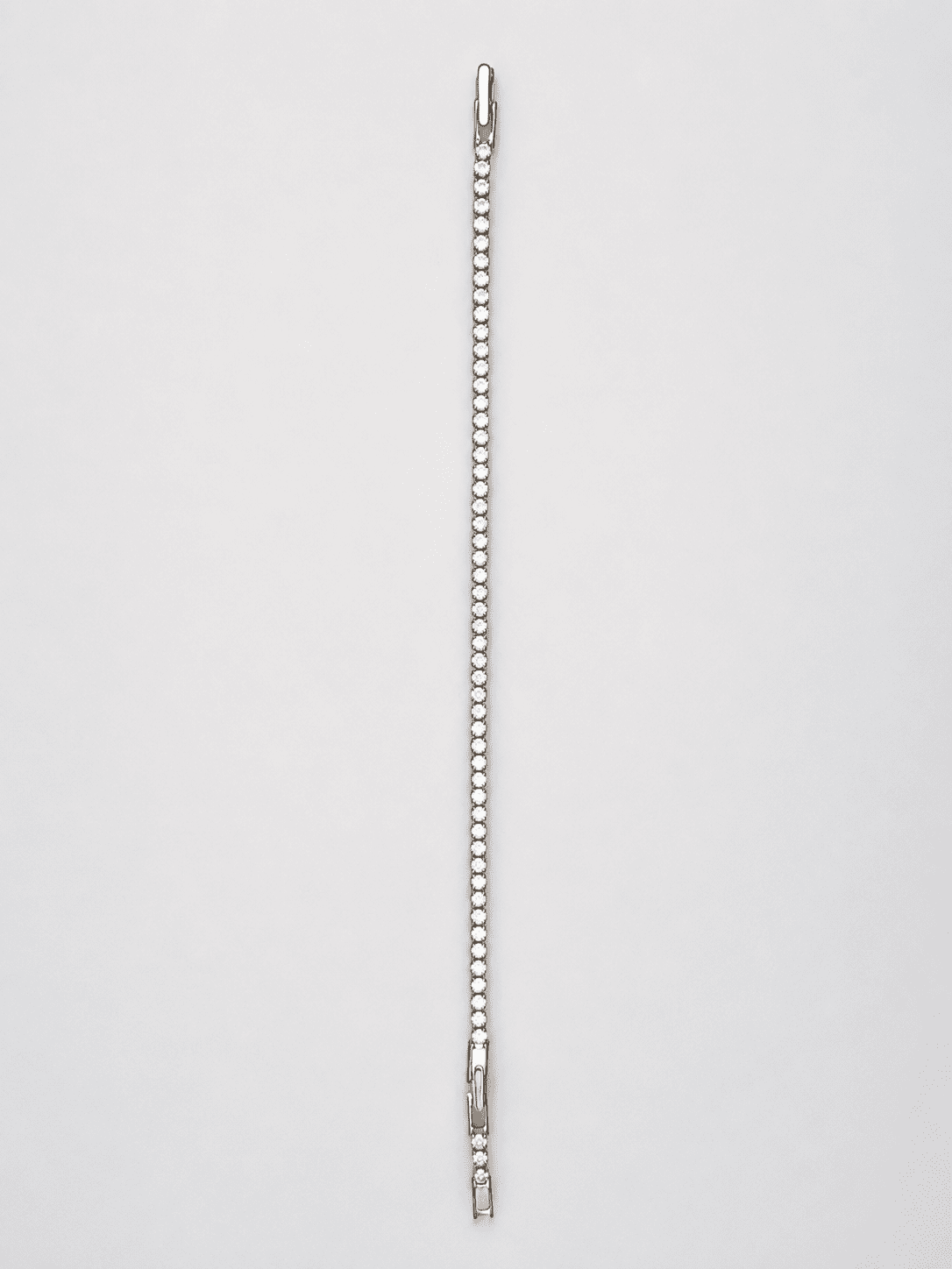 The "Skinny Dip" Tennis Bracelet — Silver-Tone Line Tennis Bracelet by House of Zena, worn on model