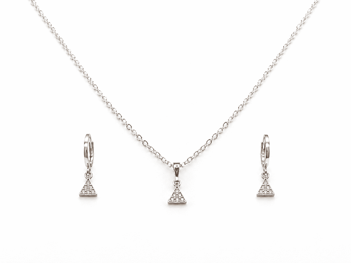 The Art Deco Geometric Set — Silver-Tone Triangle Pendant Set by House of Zena, flat lay