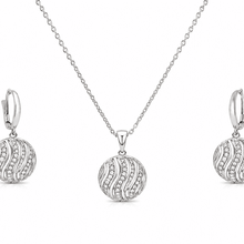 The Golden Hour Ripple Set — Silver-Tone Wave Pendant Set by House of Zena, flat lay