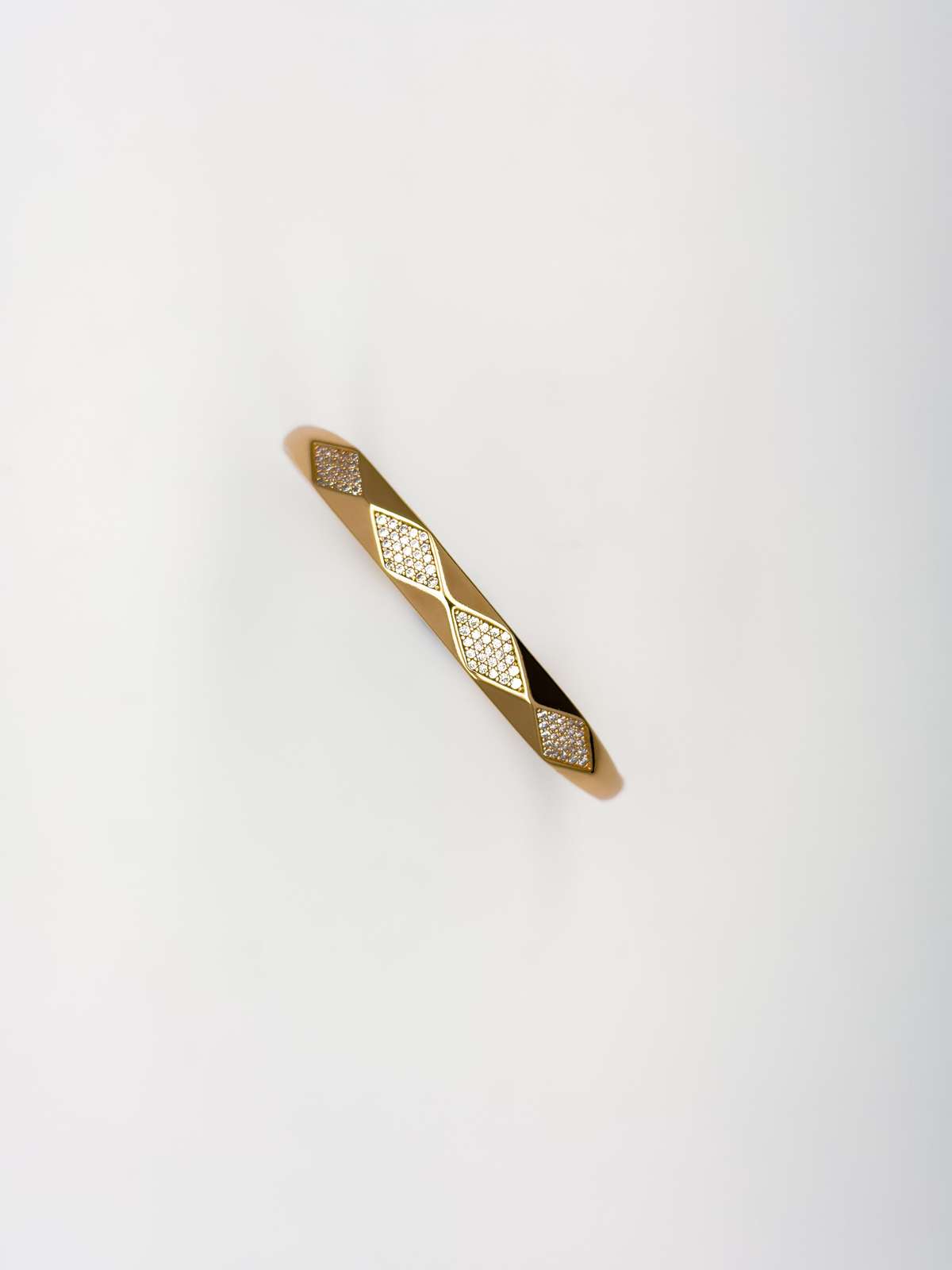The Diamond Cut Mirror Bangle — Gold Plated Prism Bangle by House of Zena, flat lay