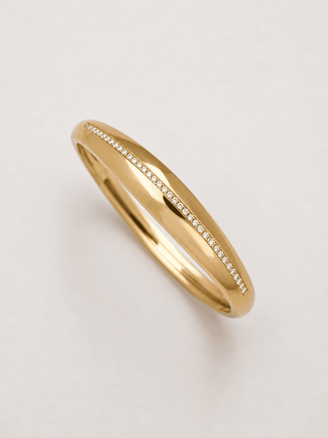 The Date Night Solitaire Bangle — Gold Plated Linea Bangle by House of Zena, worn on model