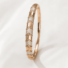 The Wishbone Chevron Bangle — Gold Plated Chevron Pavé Bangle by House of Zena, flat lay