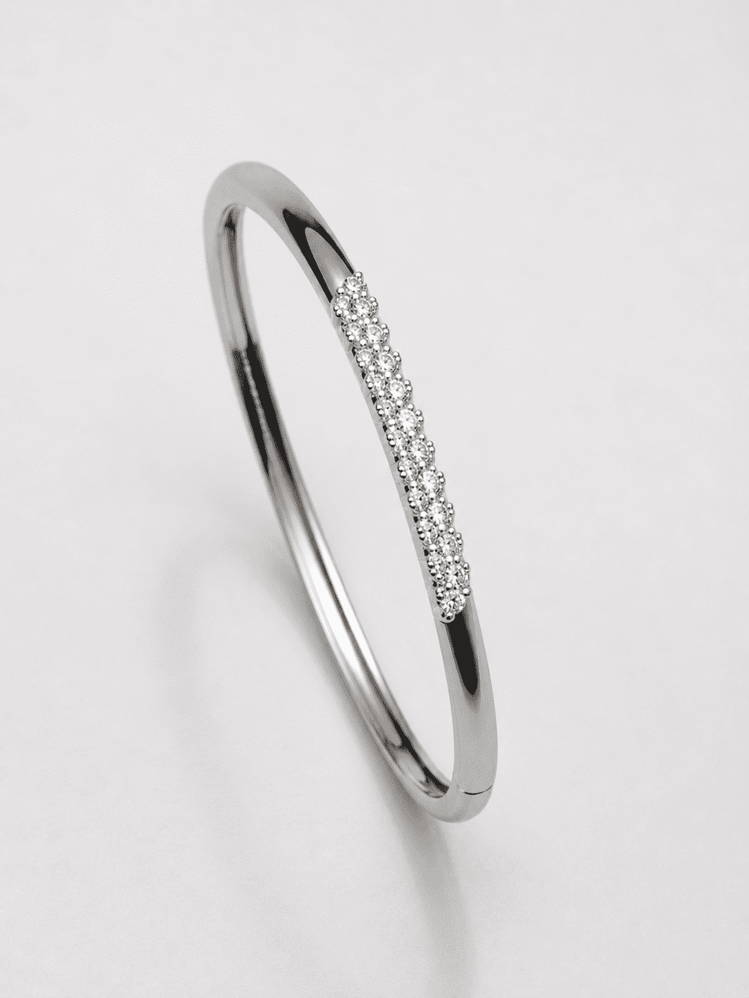 The Skinny Dip Stacking Bangle — Silver-Tone Slim Pavé Bangle by House of Zena, flat lay